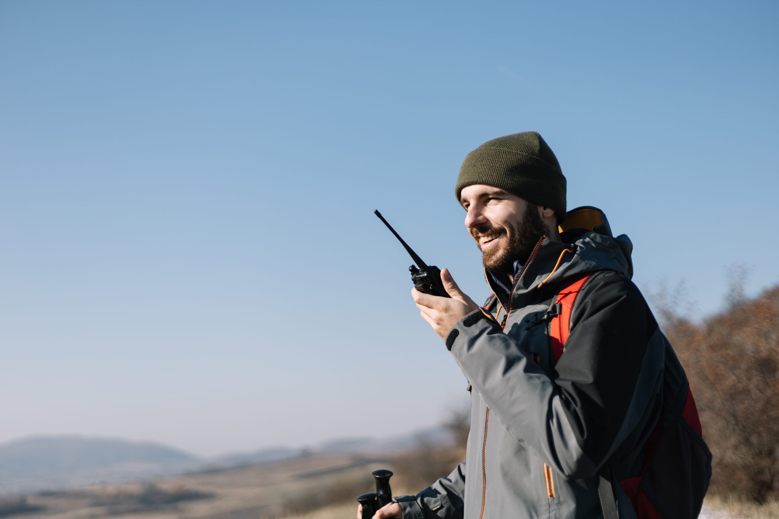 Person holding a radio and talking