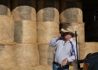 Farmer on cell phone using a booster