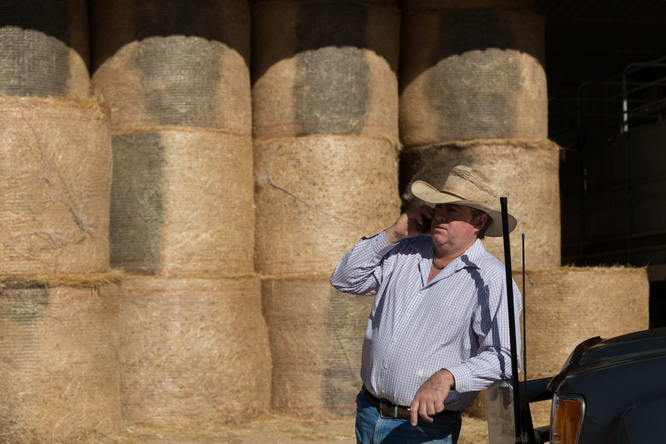 Farmer on cell phone using a booster